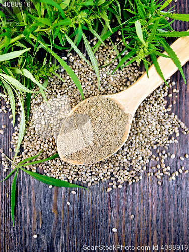 Image of Flour hemp in spoon with leaf on board top