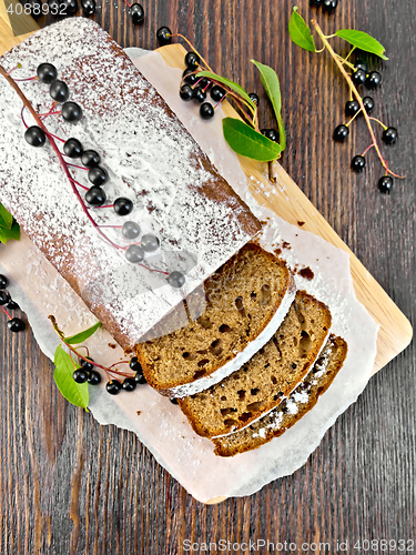 Image of Fruitcake bird cherry cut on board top