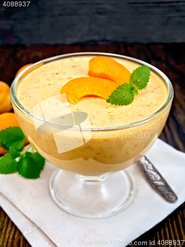 Image of Jelly air apricot in glass bowl on dark board