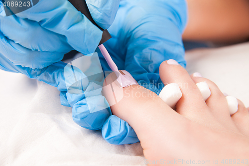 Image of Specialist making pedicure 