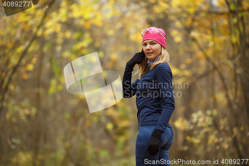 Image of Smiling girl in hat autumn