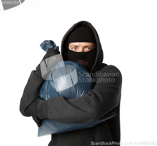 Image of Terrible robber holding large bag
