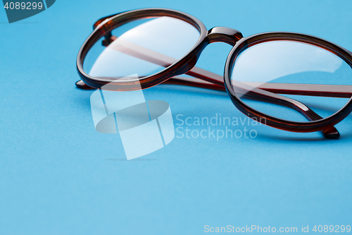 Image of Folded round glasses close up