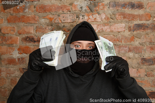 Image of Burglar in standing black gloves