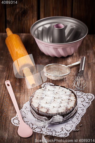 Image of Christmas cake with baking utensils