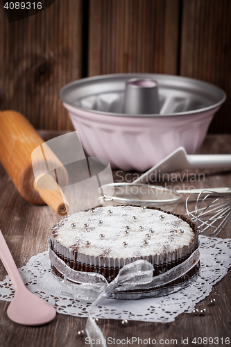 Image of Christmas cake with baking utensils