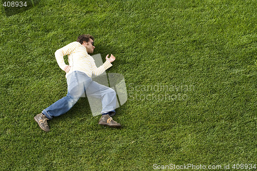 Image of Running laying down on the grass