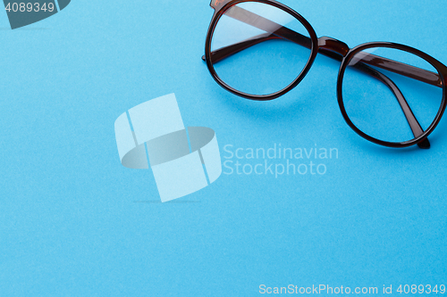 Image of Brown-rim eyeglasses in empty background