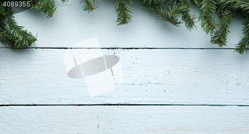 Image of Christmas, new year wooden board background with fir tree branches