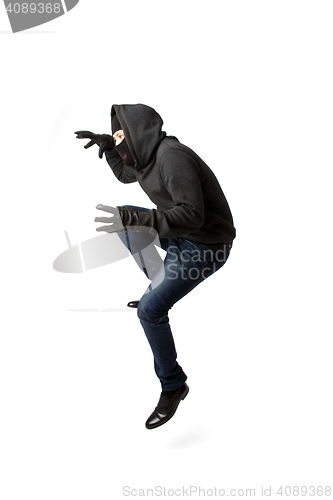 Image of Prowling thief in black mask