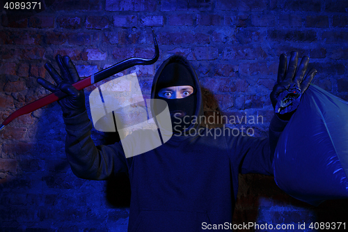 Image of Thief with master key , bag