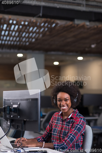 Image of portrait of a young successful African-American woman in modern 