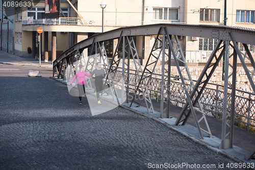 Image of young  couple jogging