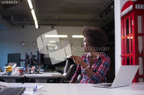 Image of portrait of a young successful African-American woman in modern 