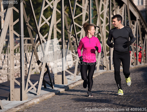 Image of young  couple jogging