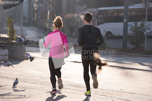 Image of young  couple jogging