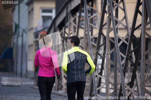 Image of young  couple jogging