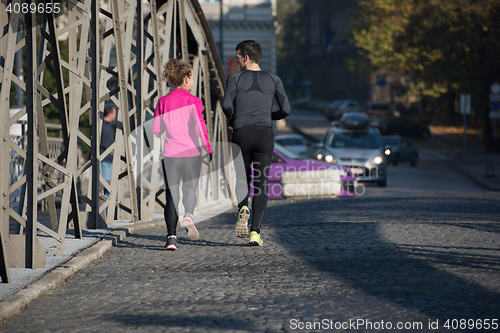 Image of young  couple jogging