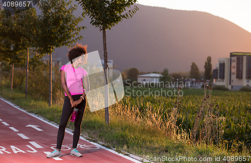 Image of Portrait of a young african american woman running outdoors
