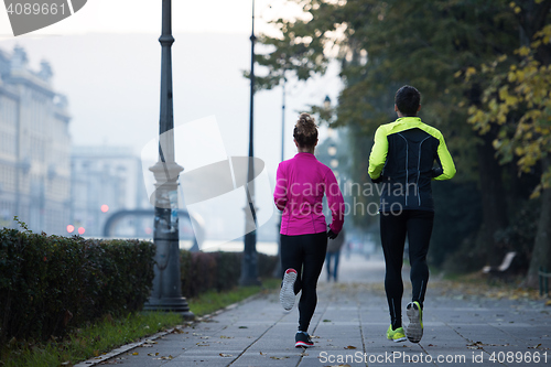 Image of young  couple jogging