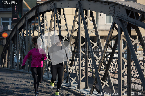 Image of young  couple jogging