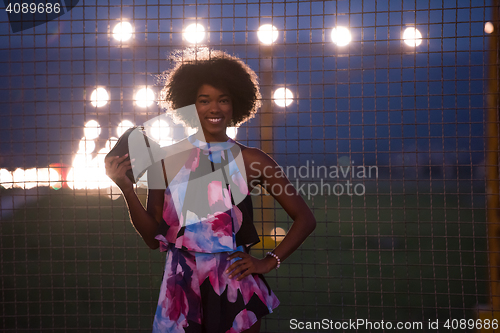 Image of portrait of a young African-American woman in a summer dress