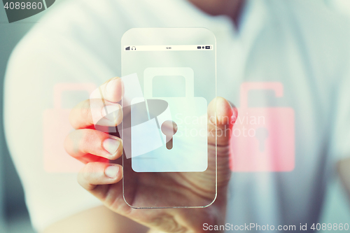 Image of close up of hand with security lock on smartphone