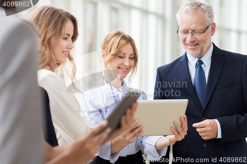 Image of business people with tablet pc computers at office