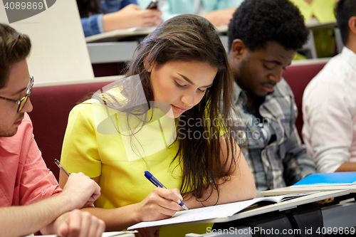 Image of group of international students writing at lecture