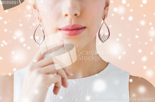 Image of close up of beautiful woman face with earrings