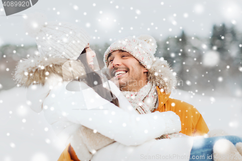 Image of happy couple outdoors in winter