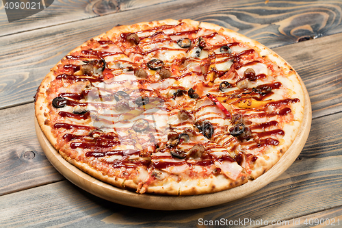 Image of Pizza On An Old Wooden Desk
