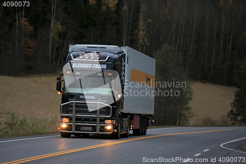 Image of Black Scania Reefer Truck on the Road