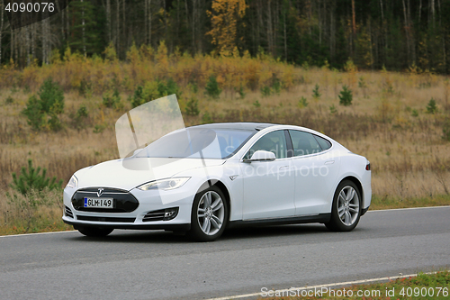 Image of White Tesla Model S on the Road in October