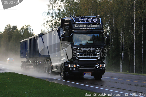 Image of Scania V8 Trucking on Rainy Road