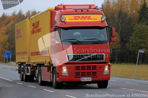 Image of Red DHL Transport Truck on the Road