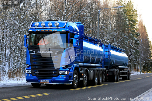 Image of Blue Scania R580 Double Tanker Trucking on Winter Afternoon