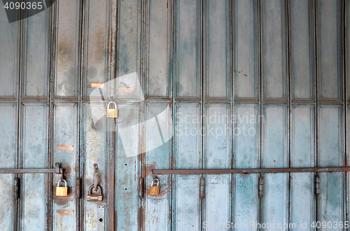 Image of Metal lock on a blue door