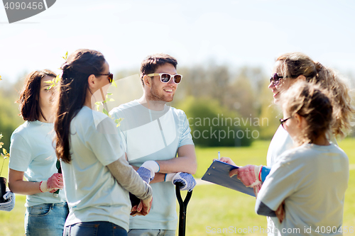 Image of group of volunteers planting trees in park