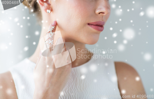 Image of close up of beautiful woman with ring and earring