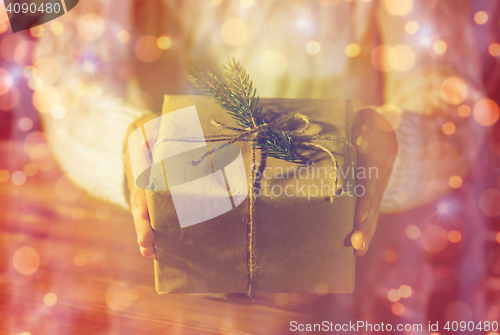 Image of close up of woman with christmas gift