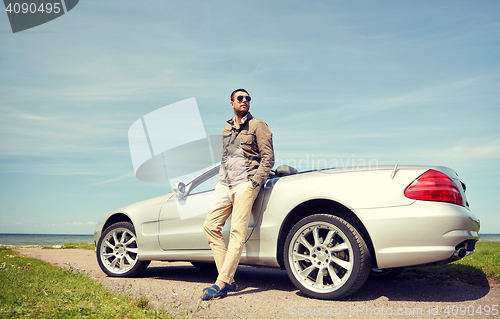 Image of man near cabriolet car outdoors