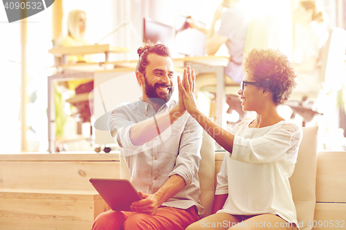 Image of office workers with tablet pc making high five