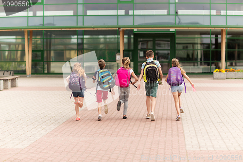 Image of group of happy elementary school students running