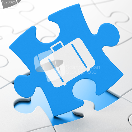 Image of Vacation concept: Bag on puzzle background