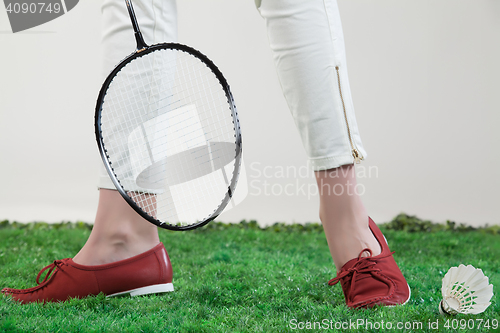 Image of Woman\'s Legs And Badminton Racket