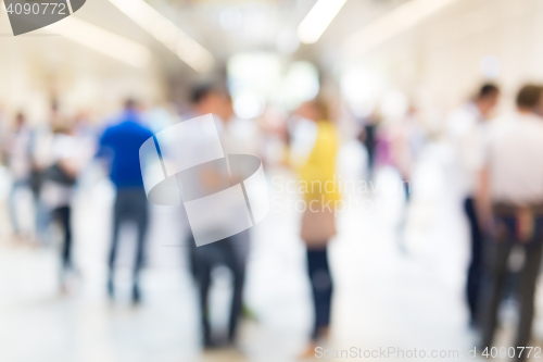 Image of Abstract blurred people socializing during coffee break at business conference.