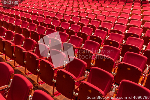 Image of Red color theatre chair in conference room.