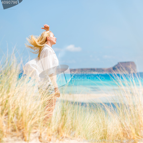 Image of Free Happy Woman Enjoying Sun on Vacations.