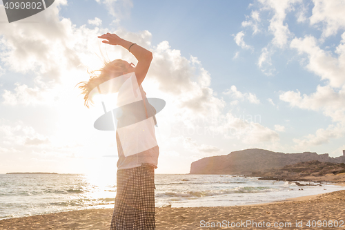 Image of Relaxed Happy Woman Enjoying Sun on Vacations.